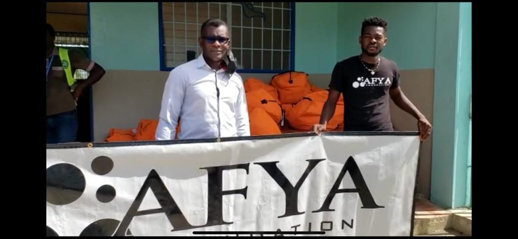 Louis with Samson of AFYA Foundation receiving medical supplies this morning.