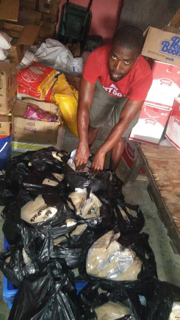 Church member is repacking the rice, beans, corn, wheat, etc, into smaller packages